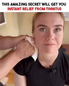 Person receiving an ear massage technique as part of a method shown to help with tinnitus and how to stop ringing in the ears.